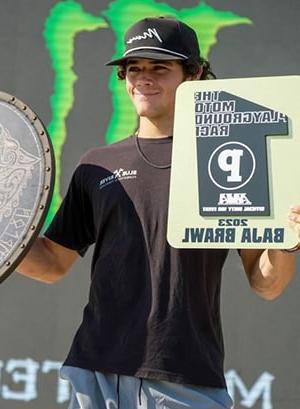Image of Maddox, a motocross competitor here at a competition showing his 1st place award, he is a student at Colorado Connections Academy. 