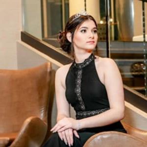 Image of Claudia in a black dress sitting down from Georgia Connections Academy. 