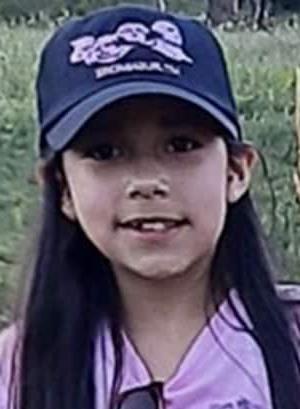 Image Abigail P, who is a student at Minnesota Connections Academy and is wearing a purple shirt and a blue hat. 